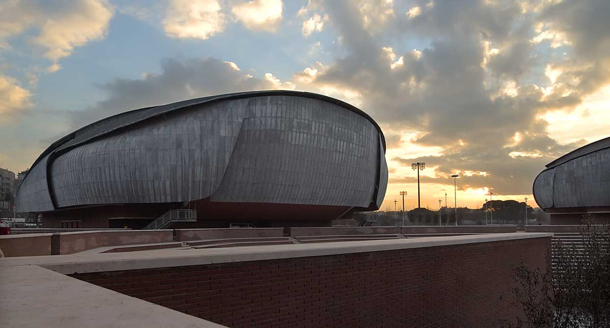 the exterior of Auditorium Parco della Musica, which is a domed concrete structure